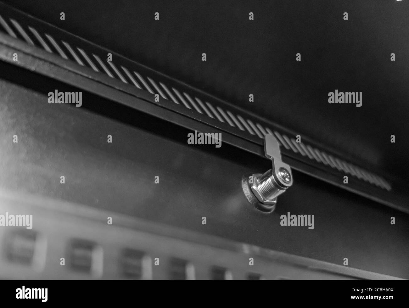 Detail of the 19-inch mounting posts together with cable entry plates seen on the base of the cabinet. The equipment rack is used to house IT servers. Stock Photo