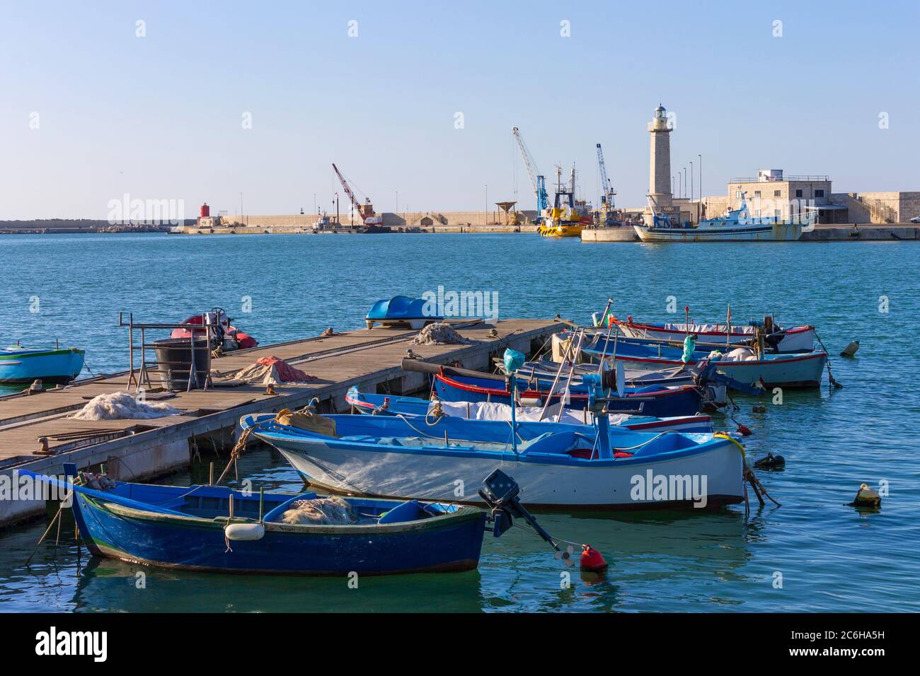 Italy, Apulia, Molfetta, boats and lighthouse Stock Photo