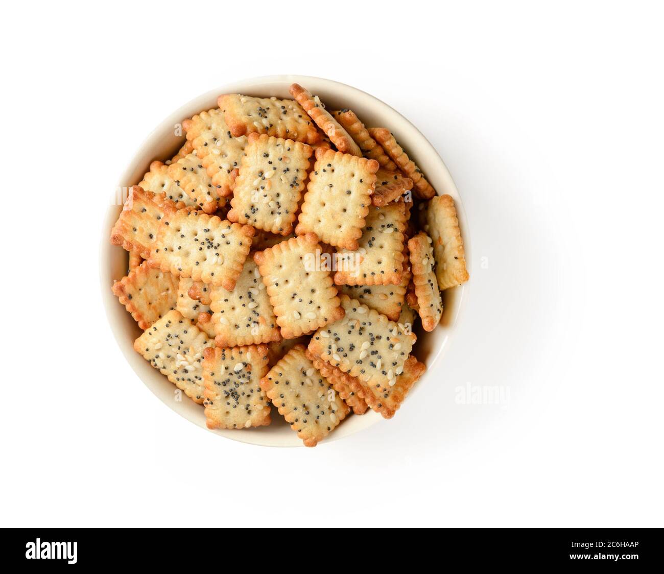 Small salty rectangular crackers with poppy and sesame seeds in a beige