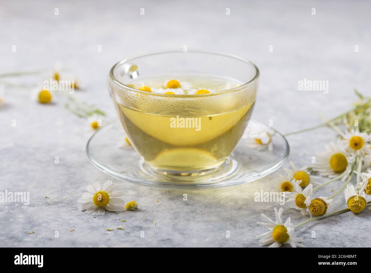 Chamomile Flowers And Chamomile Tea In Glass Teacup Top View Prevention Of Seasona Flu Colds Stock Photo Alamy