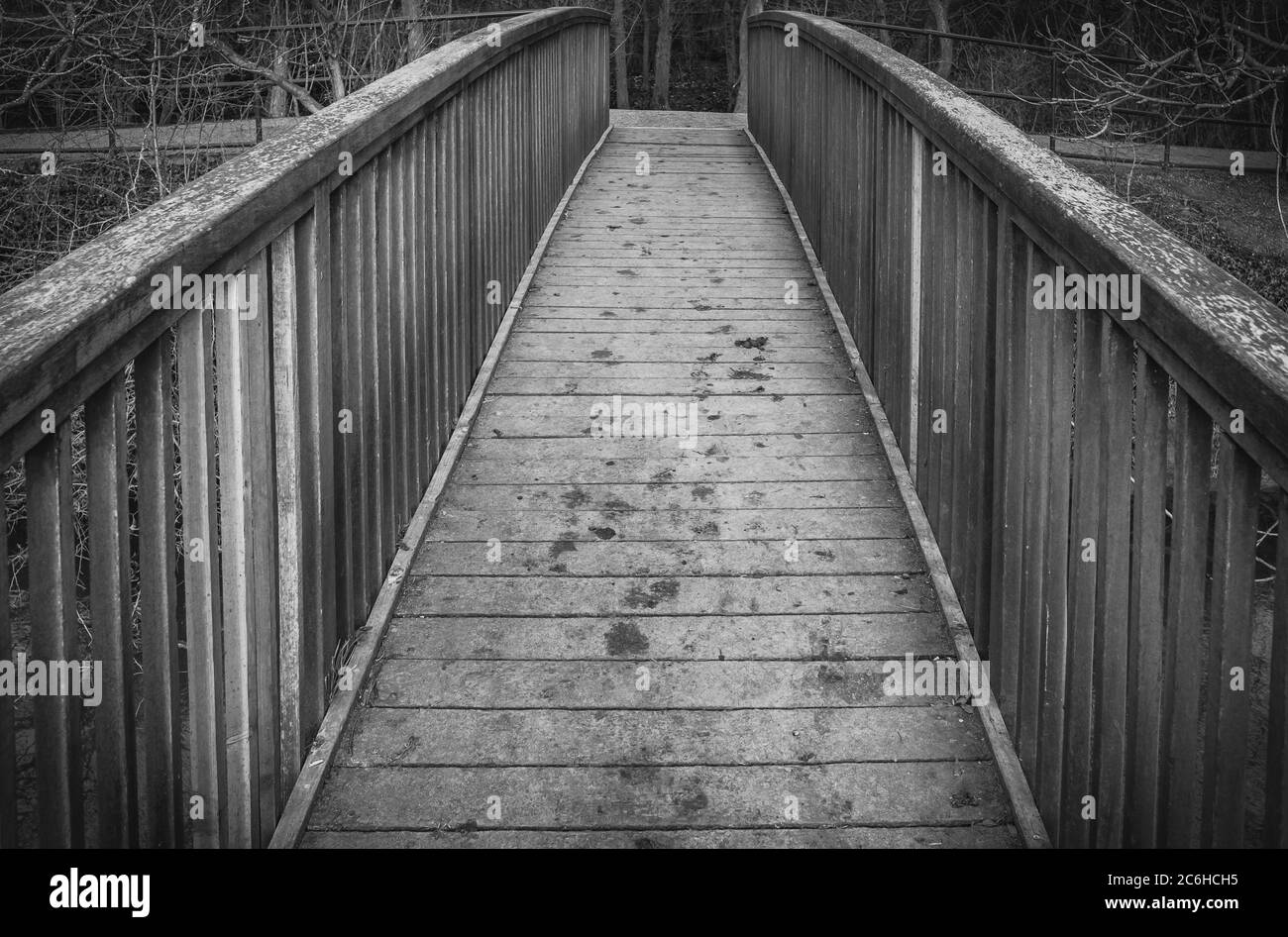 Abstract view of a timber-built footbridge showing detail of the design and construction. Spanning an inland river. Stock Photo