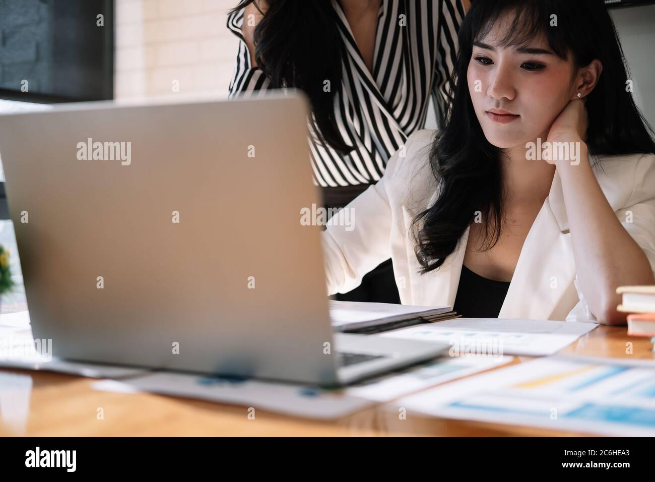 Business Team analyzing financial document on workplace - Corporate Organization Meeting Concept Stock Photo