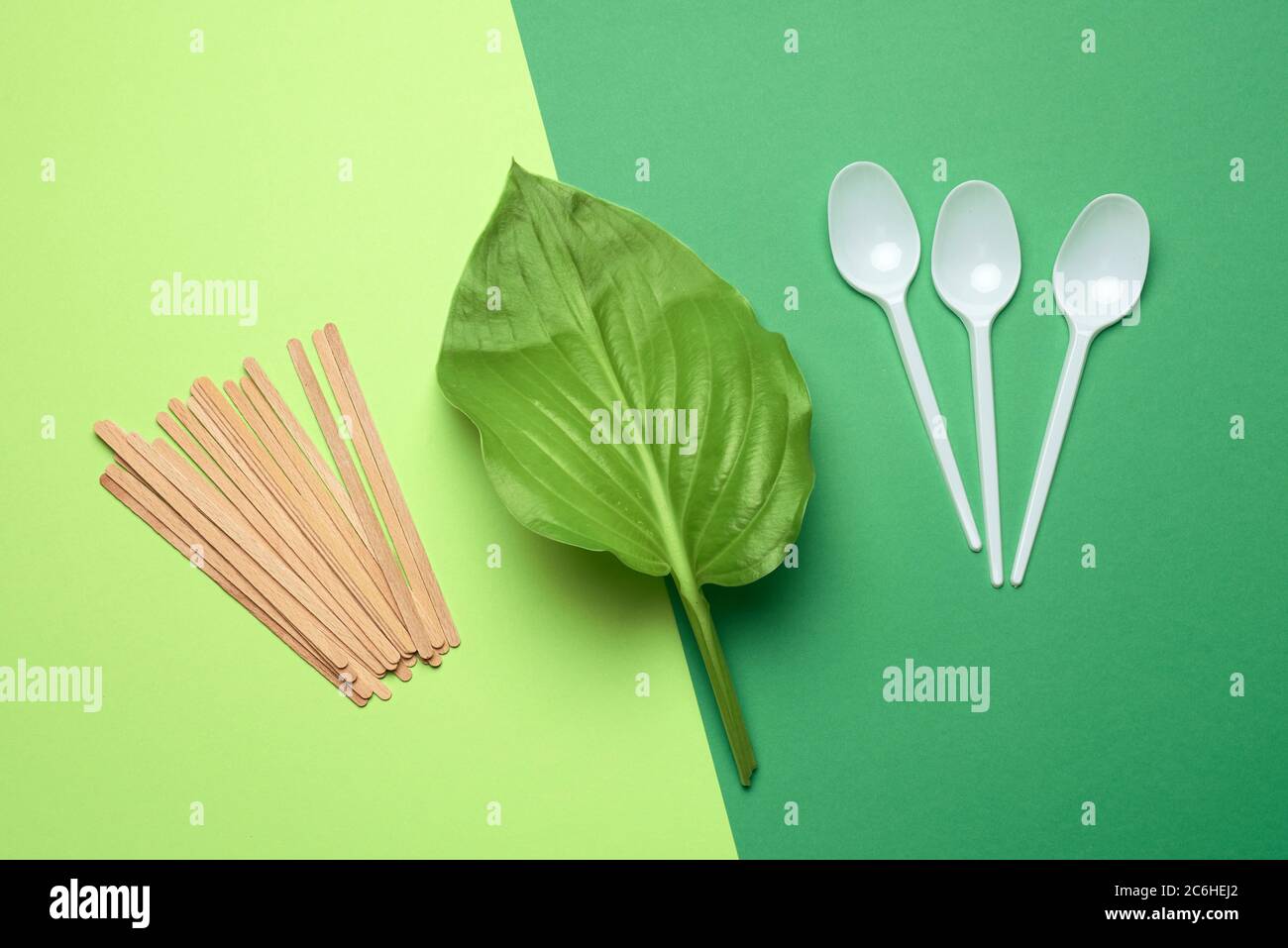 wooden sticks and disposable plastic white spoons, concept of rejection