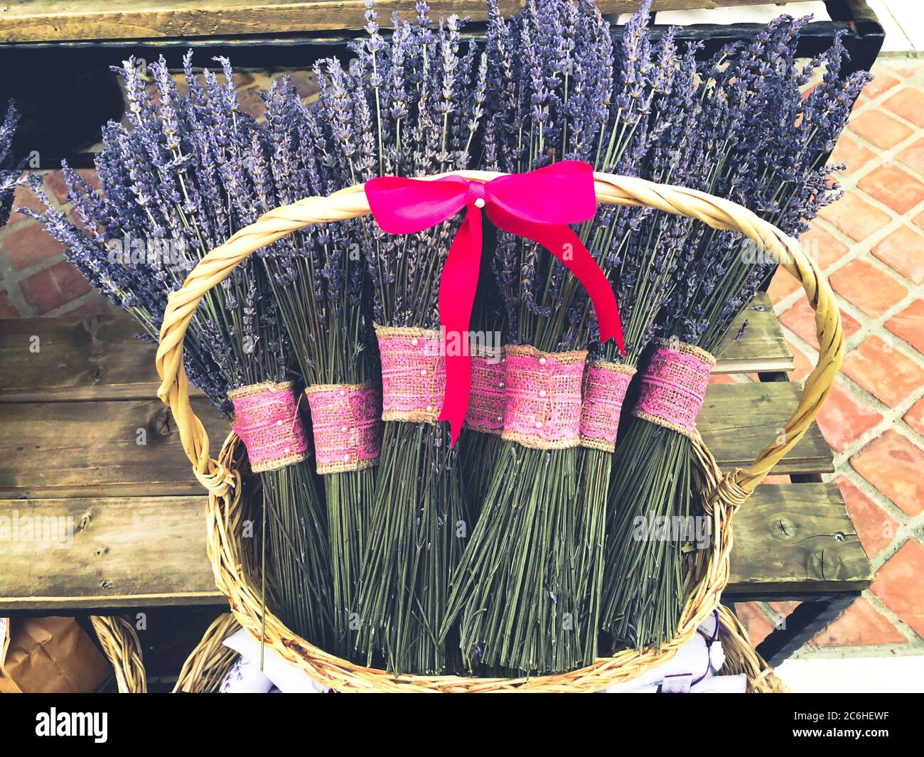 Dry lavender flowers bunch with red ribbon in a street market . Stock Photo
