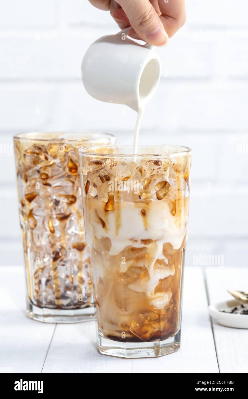 Making bubble tea, pouring blend milk tea into brown sugar pattern