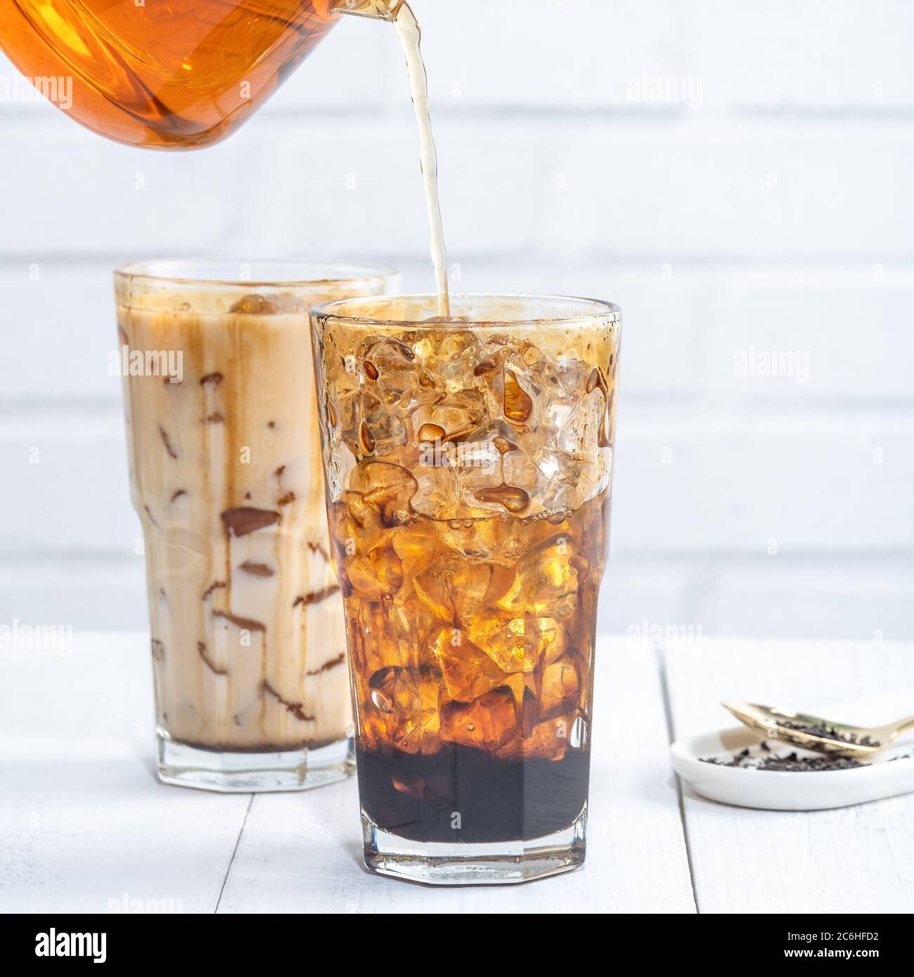 Making bubble tea, pouring blend milk tea into brown sugar pattern