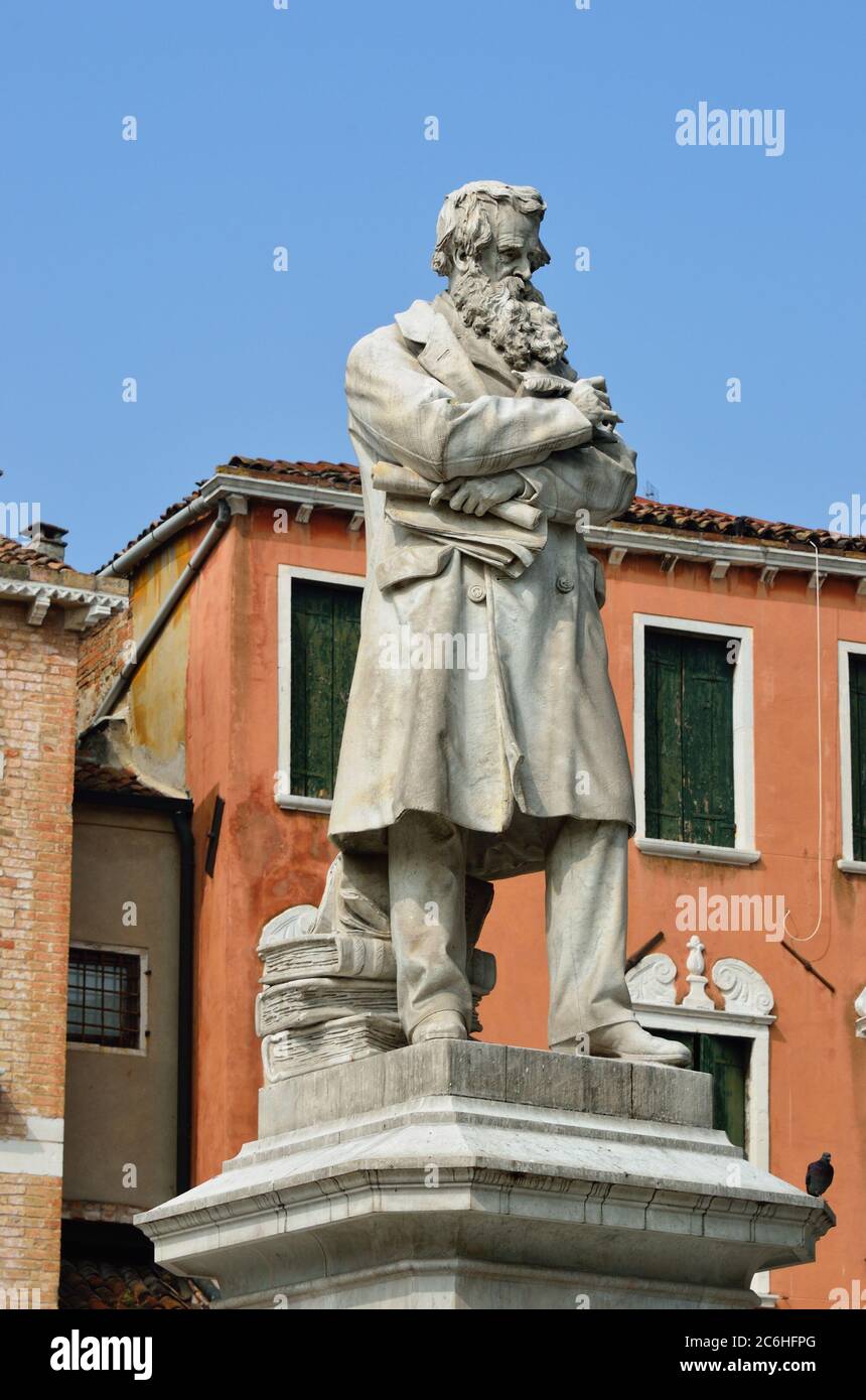 The monument to Niccolo Tommaseo in Campo Santo Stefano square, in Venice, was sculpted by Francesco Barzaghi (1839-1892), and was inaugurated on Marc Stock Photo