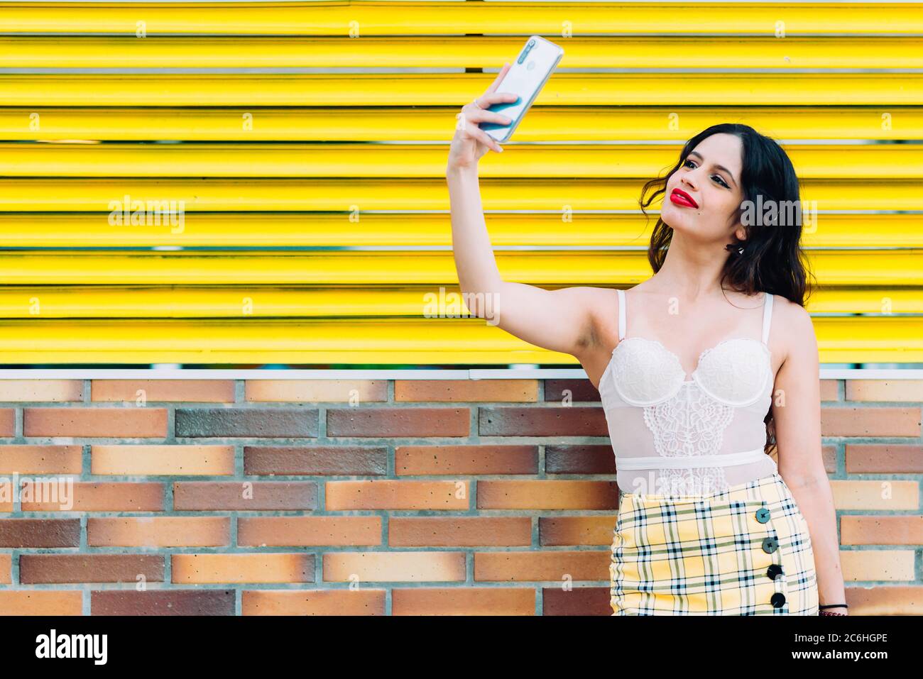 Portrait Of A Happy Young Woman Taking Selfie Stock Photo - Alamy