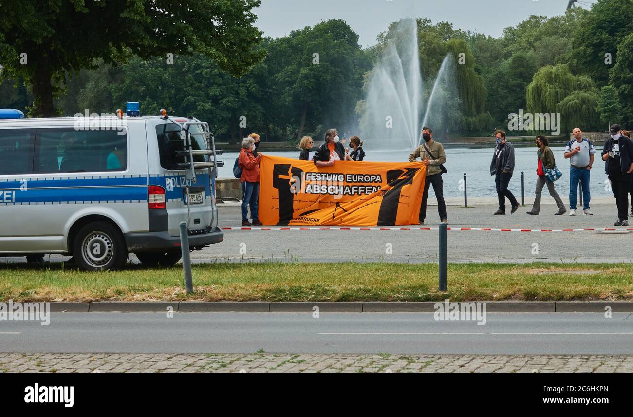Hannover, Germany, May 23., 2020 Demonstrators behind a police car