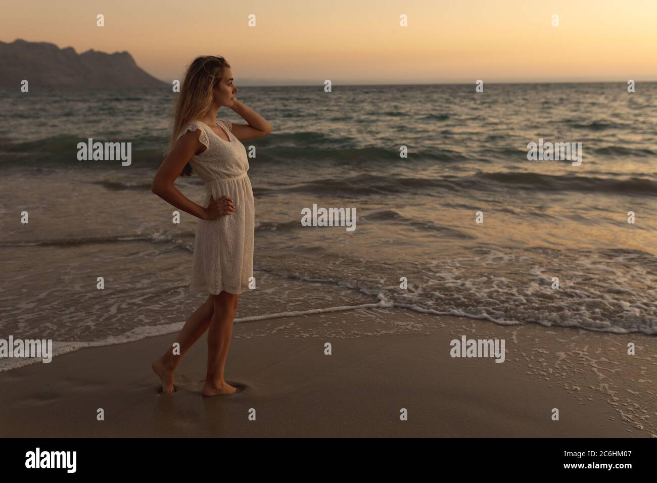 Woman barefoot on beach hi-res stock photography and images - Alamy