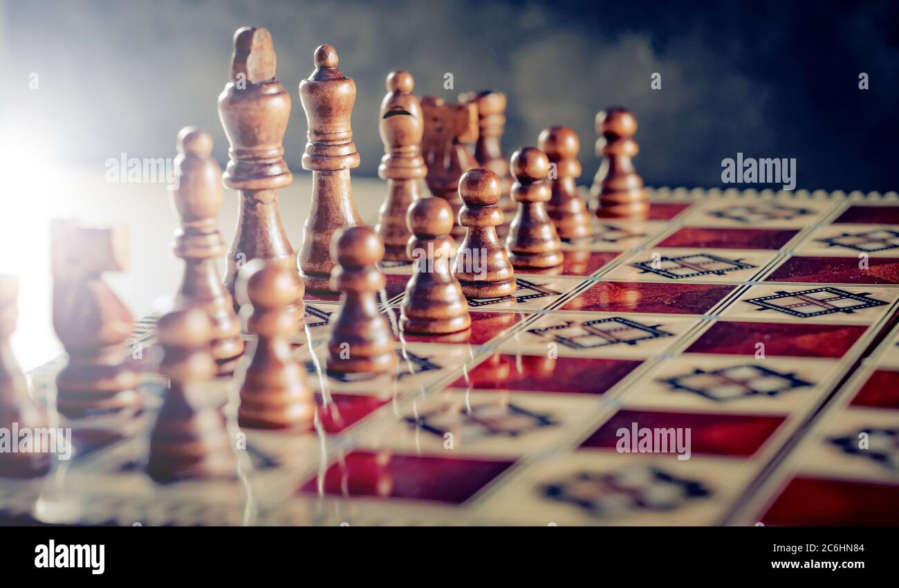 Closeup wooden figures on chess game board Stock Photo