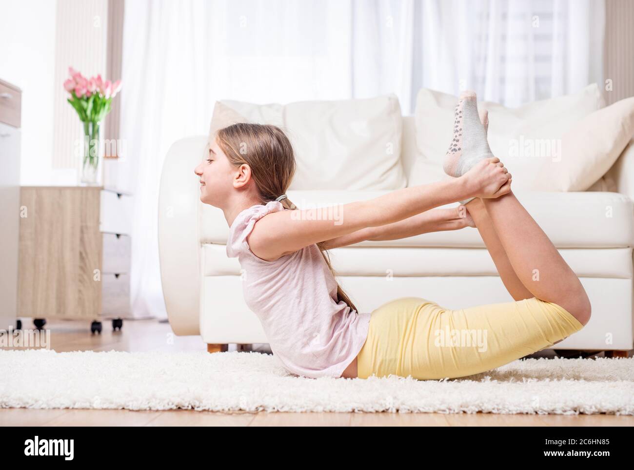 Strong athlete doing casual workout at home Stock Photo