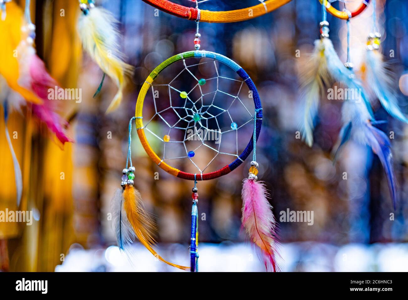 https://c8.alamy.com/comp/2C6HNC3/beautiful-colorful-dream-catcher-for-sell-in-souvenir-shop-on-blurred-background-2C6HNC3.jpg