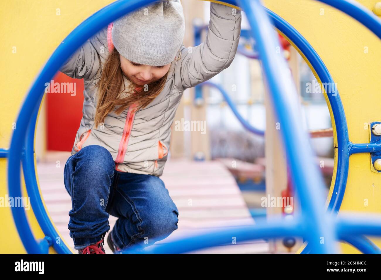 Happy girl playing at the playground Stock Photo - Alamy