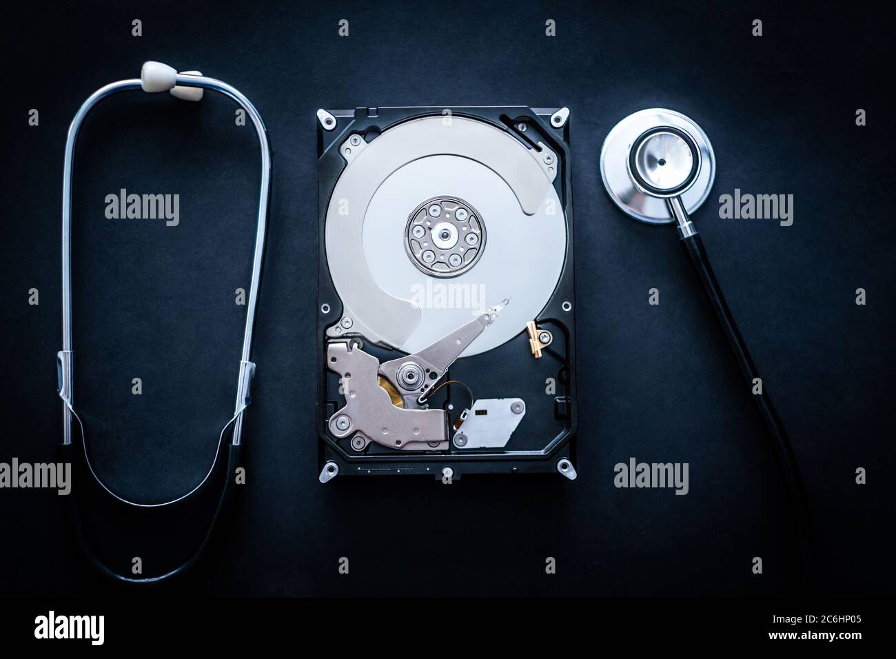 Repair of hard drive used for storage on personal computer on dark background Stock Photo