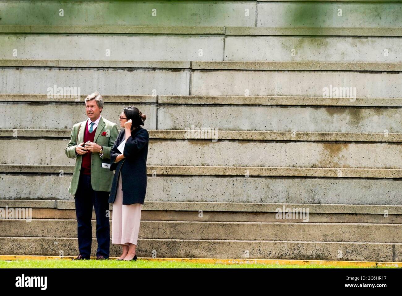 Owners wait for the race to start during day two of The Moet and Chandon July Festival at Newmarket Racecourse. Stock Photo