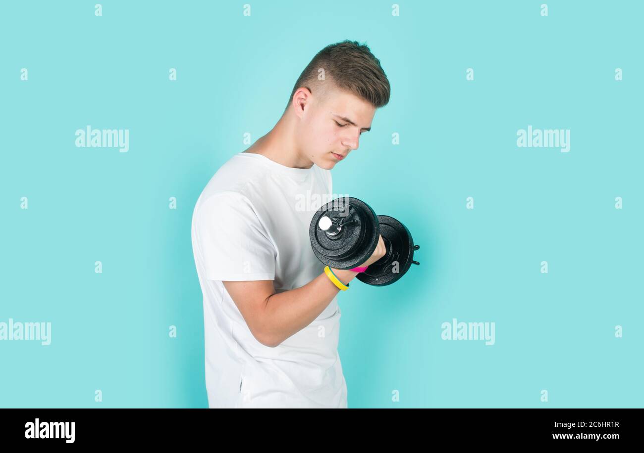 teen boy training with barbells. sport and fitness. teen guy hold dumbbell.  sportswear and equipment shop. healthy lifestyle. dieting for athletics.  strong man workout in gym Stock Photo - Alamy
