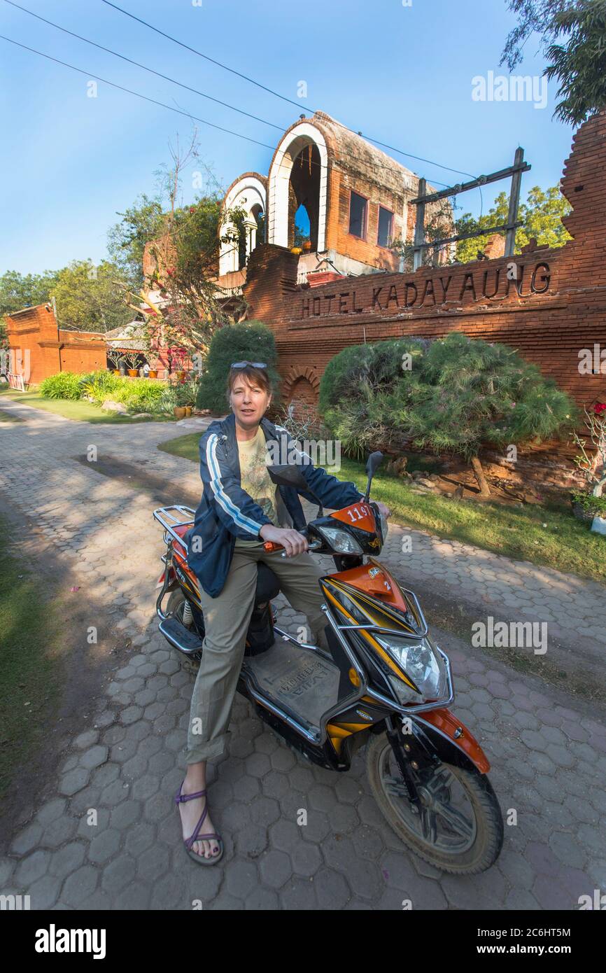 Woman Tourist on motor scooter in Bagan, Myanmar Stock Photo