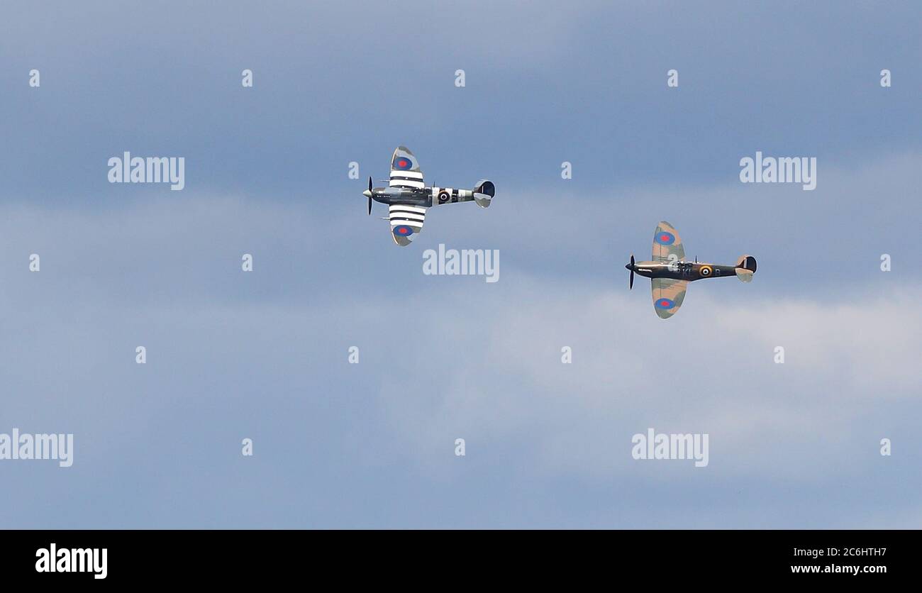 Ditchling, UK. 10th July, 2020. A Spitfire and a Hurricane perform a flypast over the village of Ditchling to honour Dame Vera Lynn who's funeral takes place today, The ‘Forces Sweetheart' died aged 103 in June. Credit: James Boardman/Alamy Live News Stock Photo