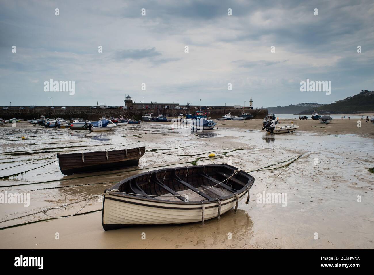 View of boats in St. Ives beach at low tide in Cornwall in England Stock Photo