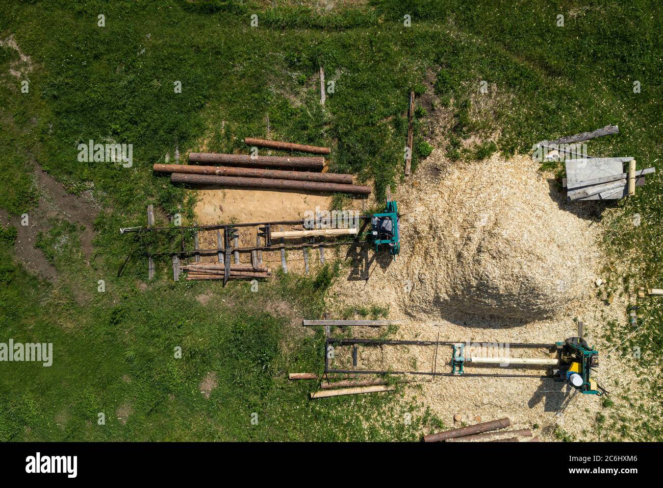 production of logs for wooden houses top view Stock Photo