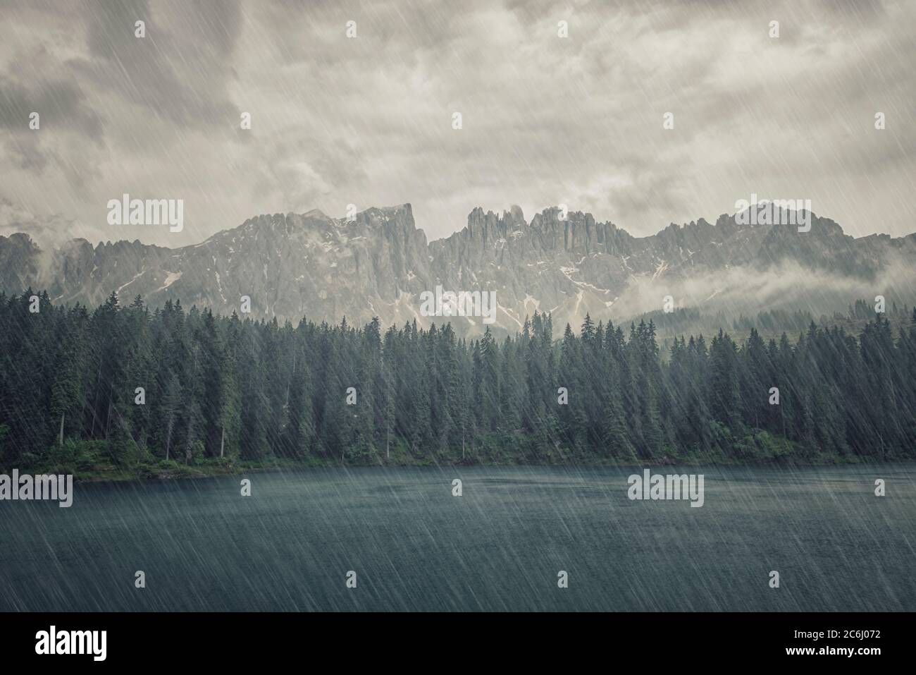 Rainy day on Carezza lake in the Italian Dolomites Stock Photo