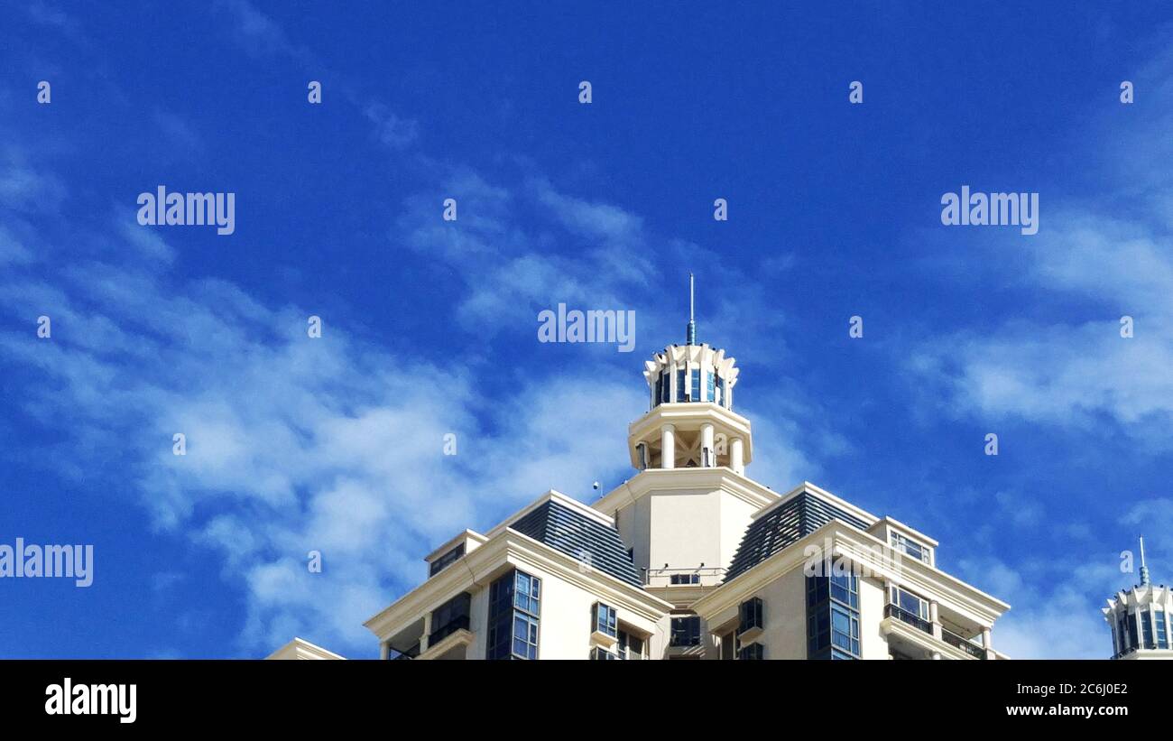 Shenzhen, China: residential buildings under blue sky and white clouds ...