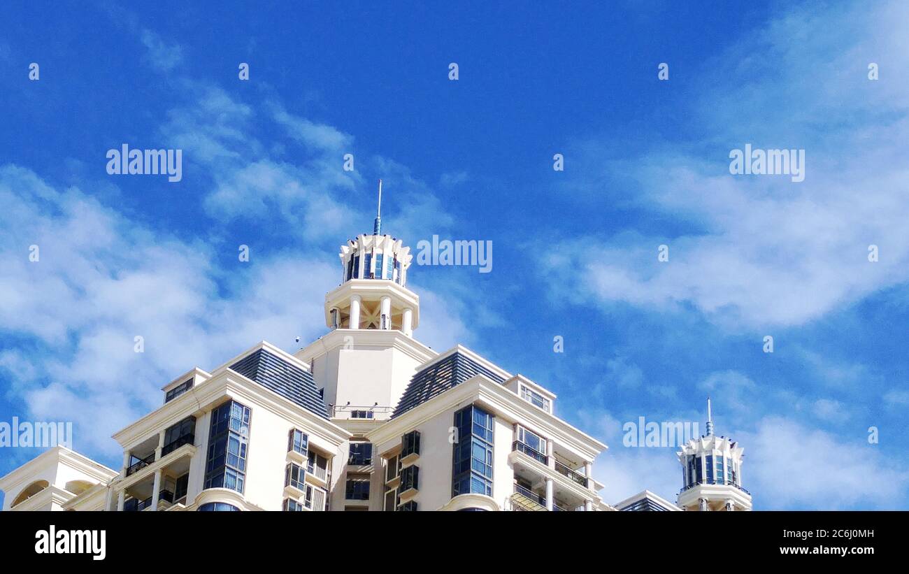 Shenzhen, China: residential buildings under blue sky and white clouds ...