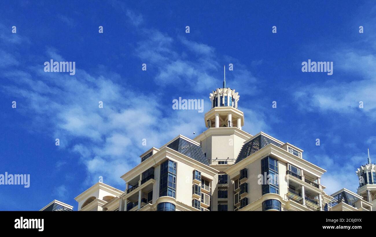 Shenzhen, China: residential buildings under blue sky and white clouds ...