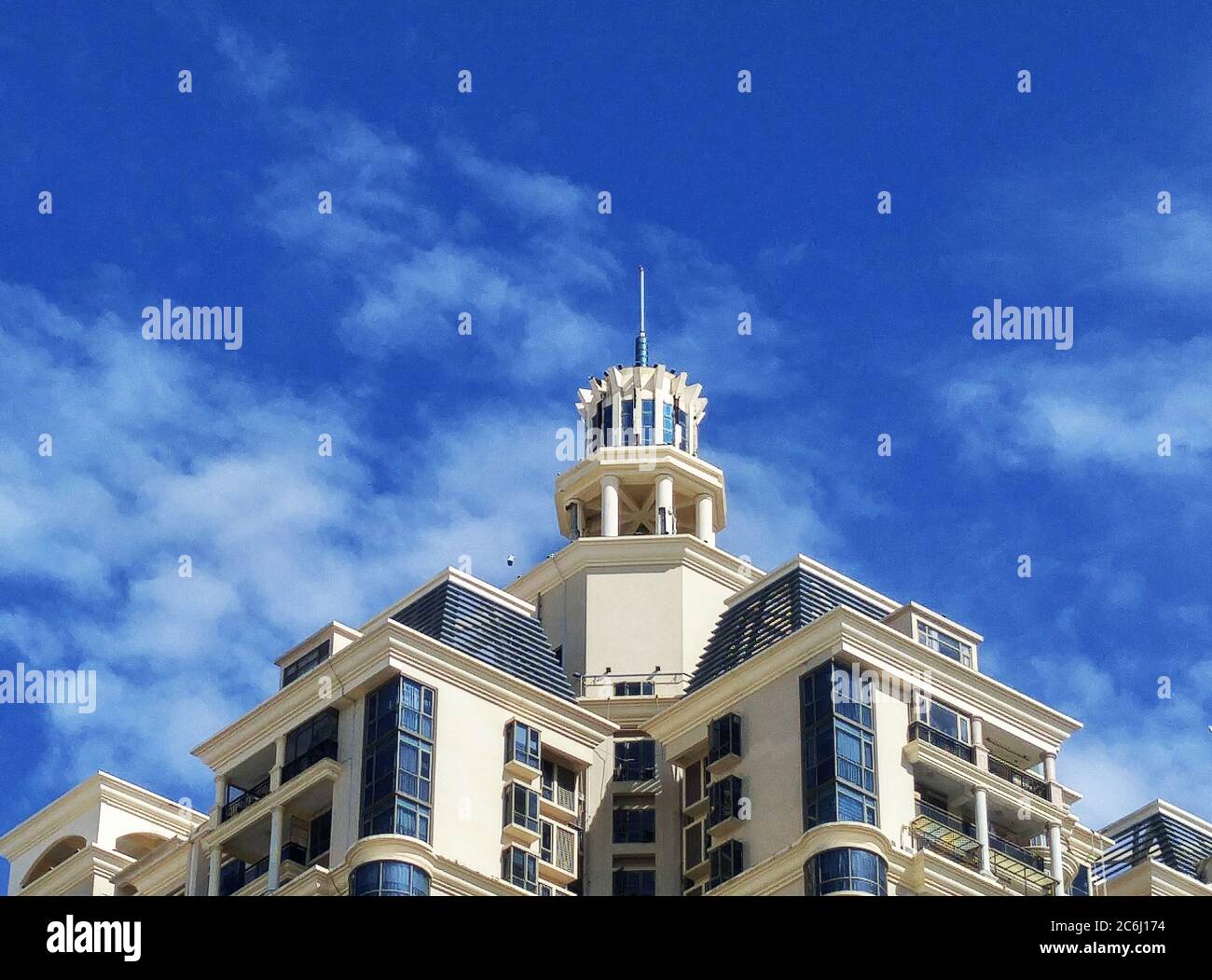 Shenzhen, China: residential buildings under blue sky and white clouds ...