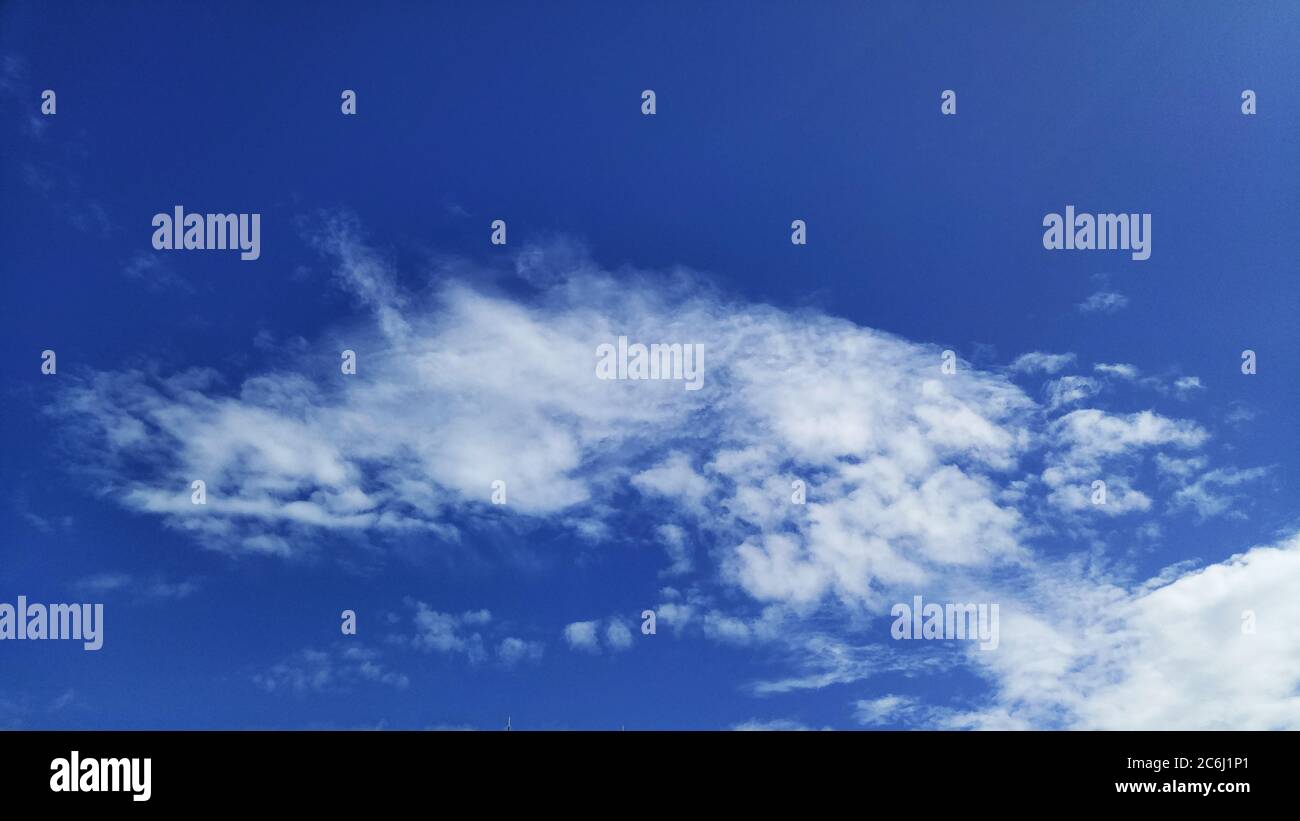 Shenzhen, China: residential buildings under blue sky and white clouds ...