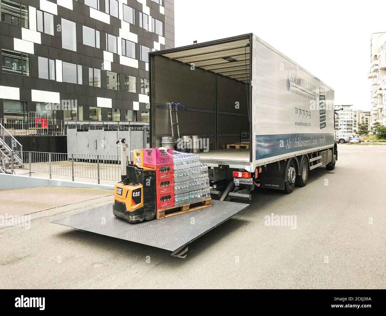 Beverages Being Unloaded From A Forklift On A Tailgate Loader In The Back Of A Delivery Truck In Front Of An Office Building Copenhagen Denmark Ju Stock Photo Alamy