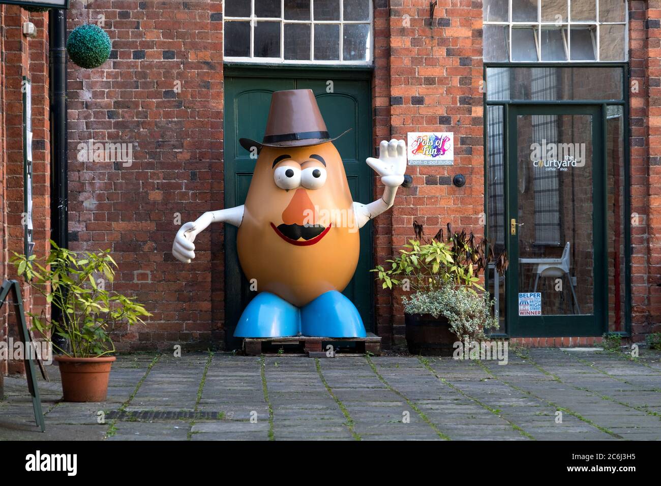Giant Mr potato head waving Stock Photo