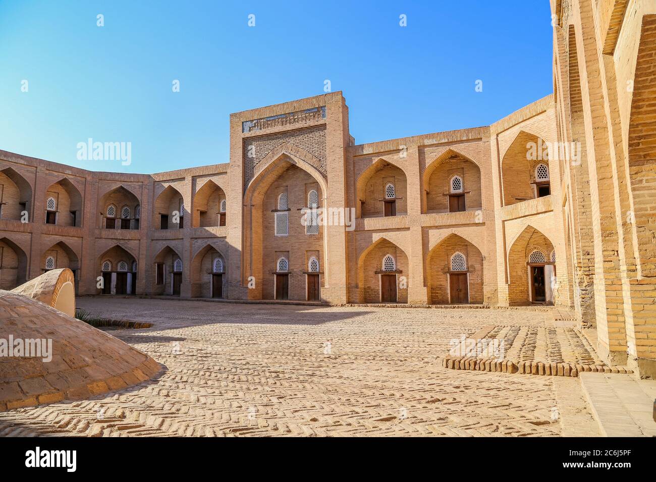 KHIVA, UZBEKISTAN - AUGUST 1, 2018: The exterior of the Qutlugh Murad Inaq Madrassa in Khiva, Uzbekistan. UNESCO heritage site Stock Photo