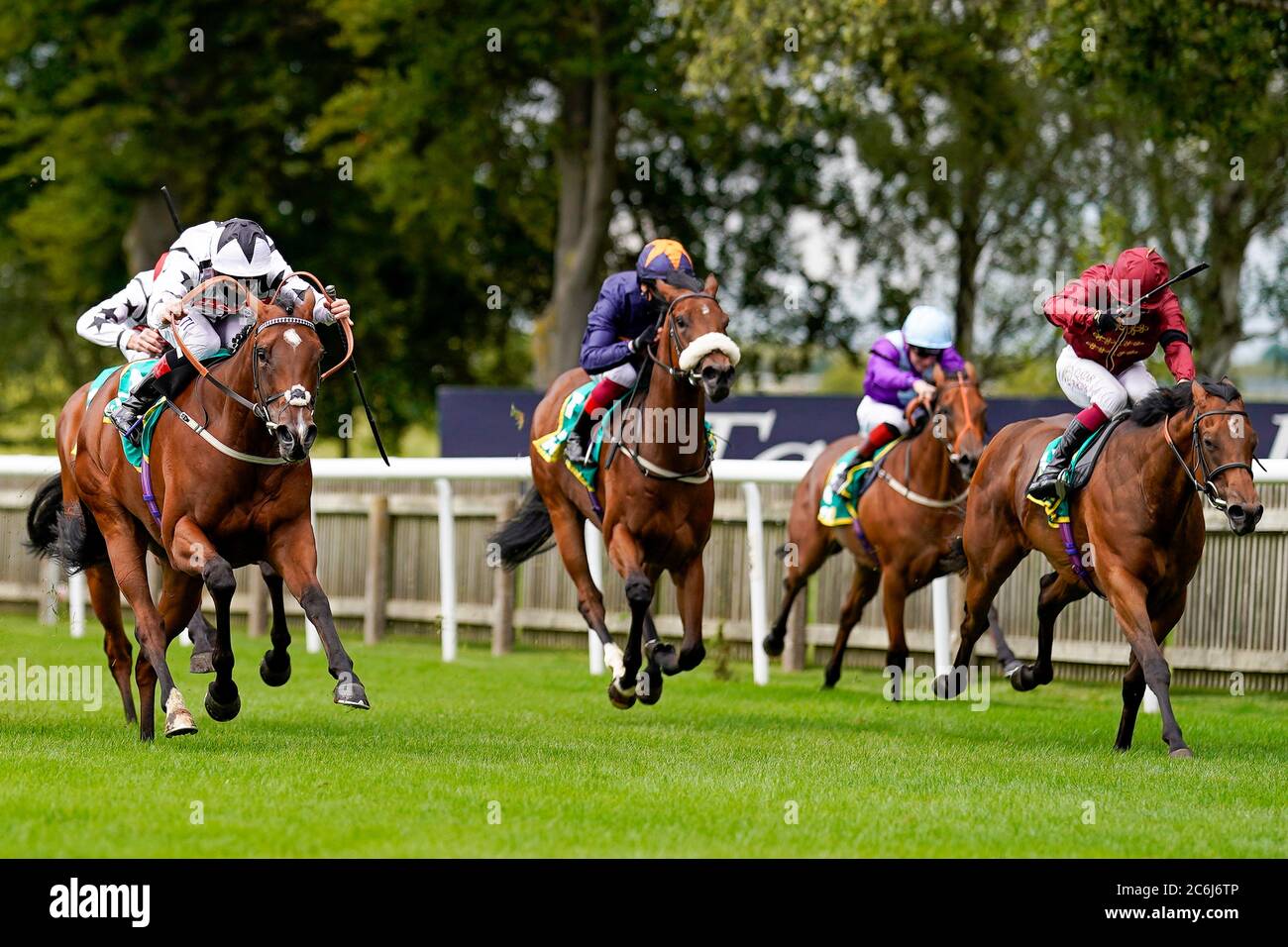 Ben Curtis riding Dandalla (white/black star) win The Duchess Of Cambridge Stakes during day two of The Moet and Chandon July Festival at Newmarket Racecourse. Stock Photo