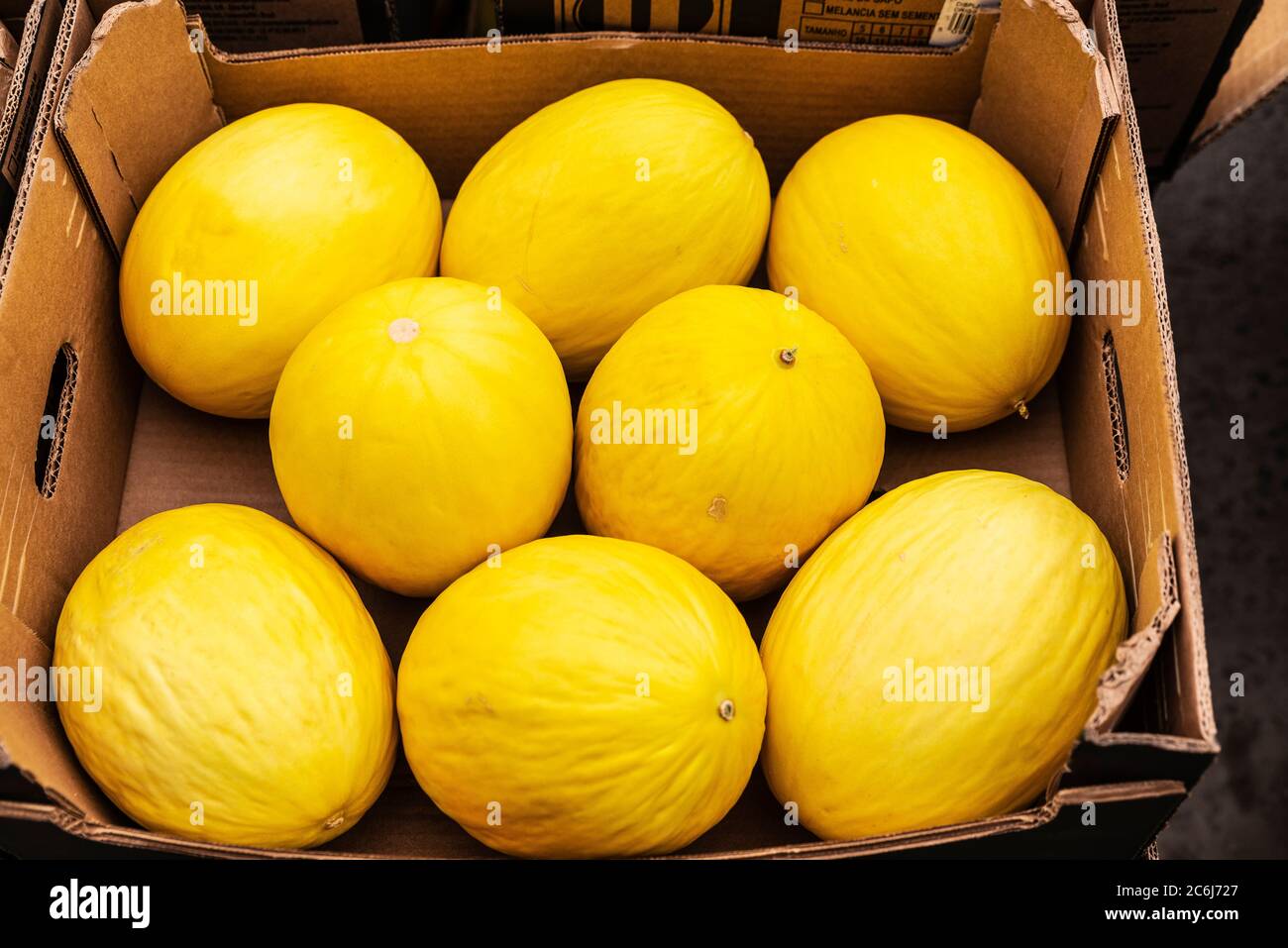 Cardboard box with yellow melons on a street in Dublin, Ireland Stock Photo
