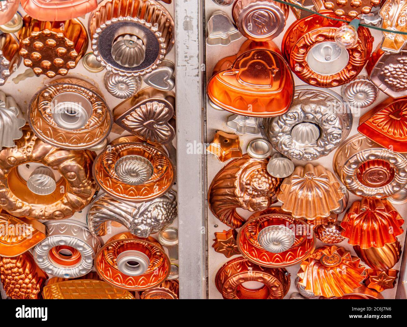https://c8.alamy.com/comp/2C6J7N6/fun-dcor-ceiling-covered-with-old-copper-colored-metal-jello-salad-molds-for-decoration-and-light-fixtures-2C6J7N6.jpg