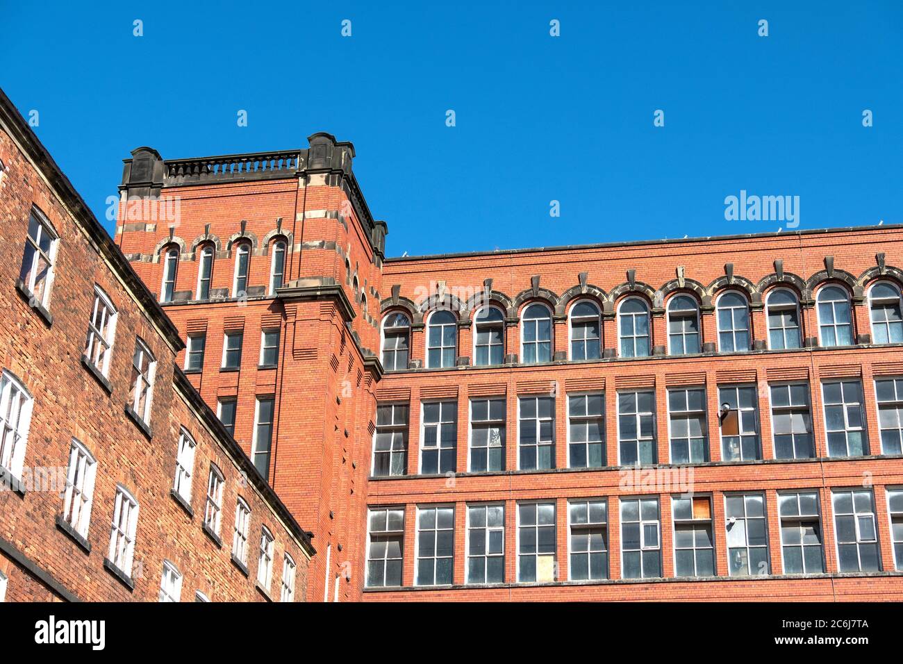 Tall old Derbyshire mill building Stock Photo - Alamy