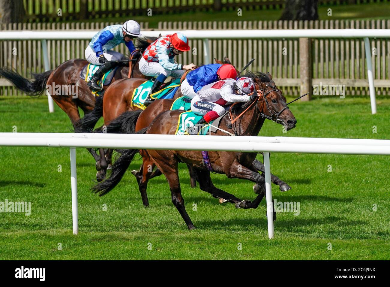 Frankie Dettori riding Cape Coast (right) win The bet365 Trophy during day two of The Moet and Chandon July Festival at Newmarket Racecourse. Stock Photo