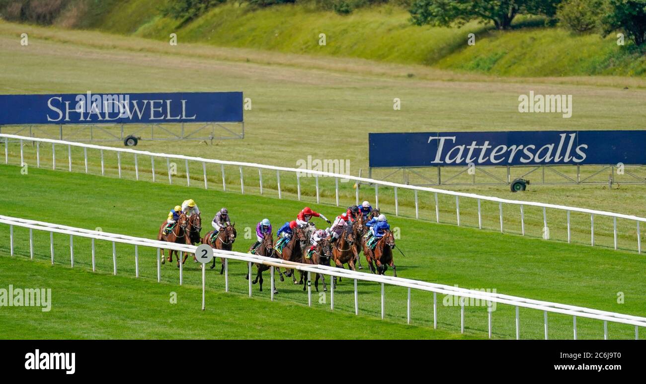 Frankie Dettori riding Cape Coast (front left) lead the filed on the way to winning The bet365 Trophy during day two of The Moet and Chandon July Festival at Newmarket Racecourse. Stock Photo