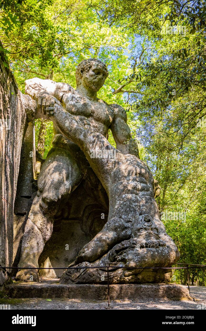June 28, 2020 - Sacro Bosco (Sacred Grove) or Park of the Monsters of Bomarzo - Mannerist monumental garden. The struggle of the two giants Ercole and Stock Photo