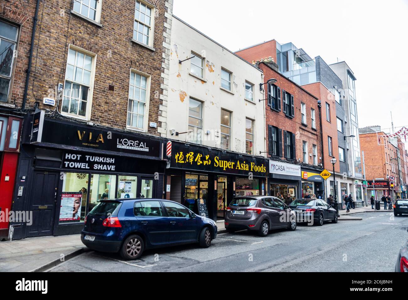 Dublin, Ireland December 30, 2019 Street with shops, restaurants and people around in the