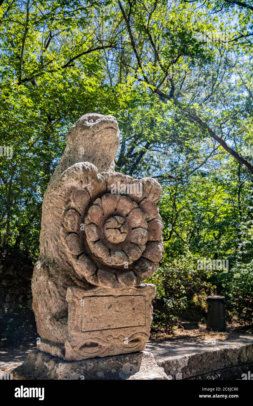 June 28, 2020 - Sacro Bosco (Sacred Grove) or Park of the Monsters of Bomarzo - Mannerist monumental garden. The bear with the Roman rose, coat of arm Stock Photo