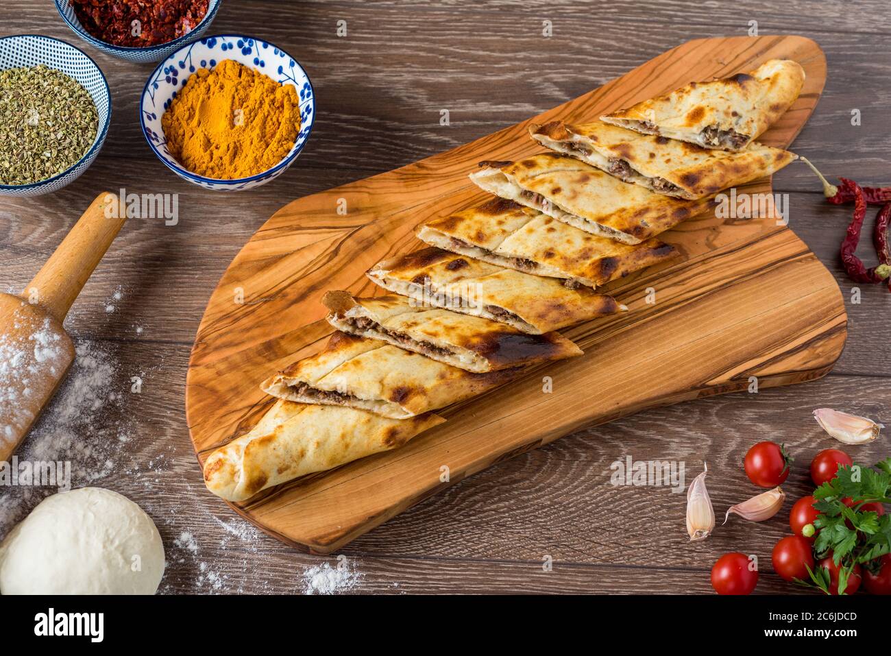 Traditional turkish baked dish pide. Turkish pizza pide, Middle eastern appetizers. Turkish cuisine. Top view. Pide with meat filling. Stock Photo