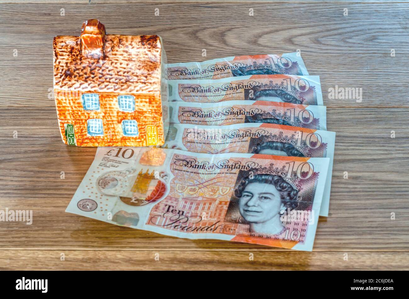Model house and money - housing finance concept Stock Photo