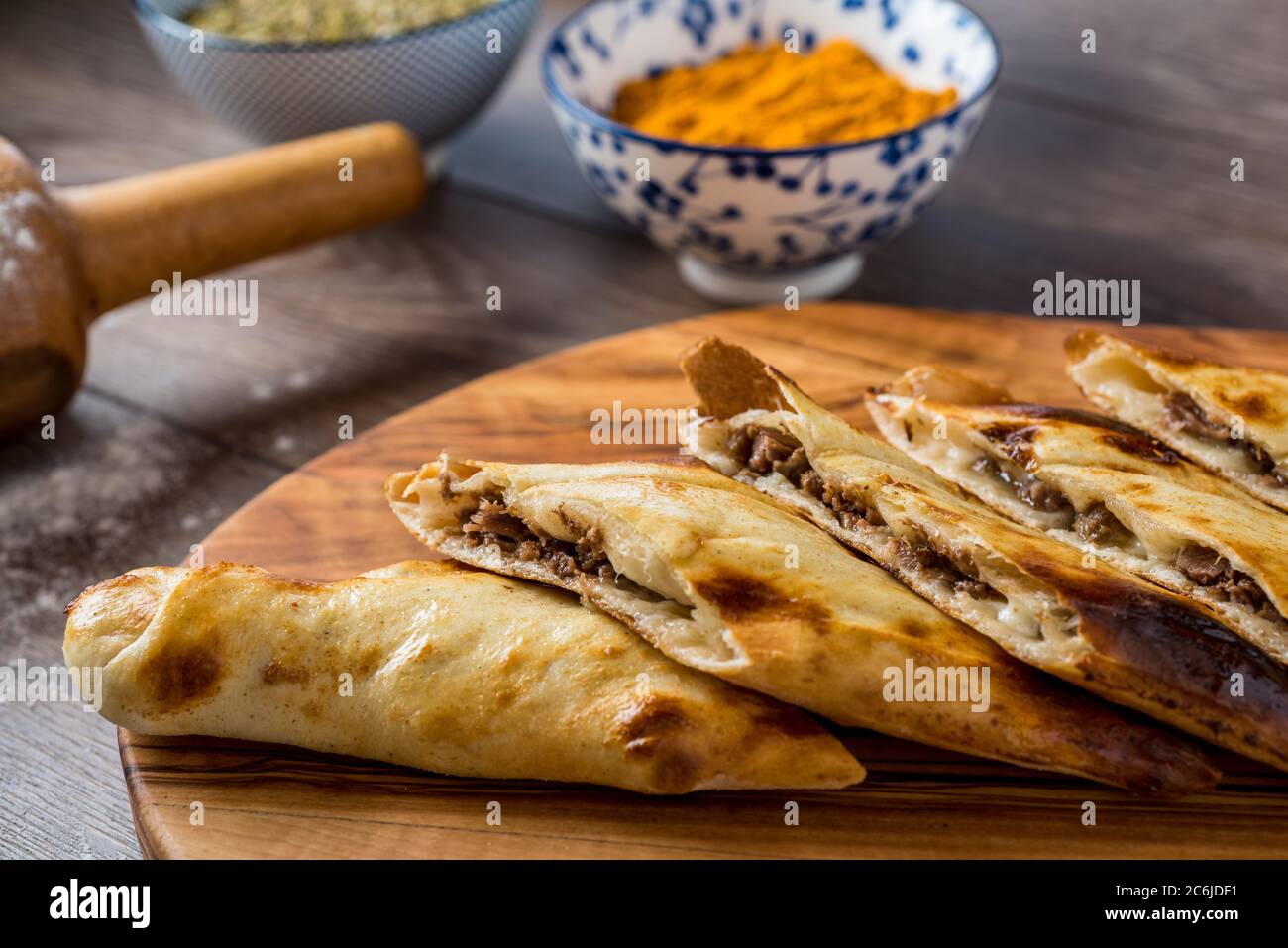 Traditional turkish baked dish pide. Turkish pizza pide, Middle eastern appetizers. Turkish cuisine. Top view. Pide with meat filling. Stock Photo