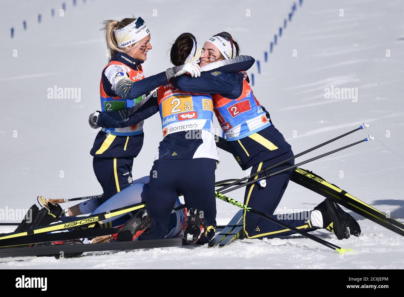 Swedish women celebrate as teammate Stina Nilsson wins women's cross-country  relay at the Nordic World Championships, Seefeld, Austria, 2019. Stock Photo