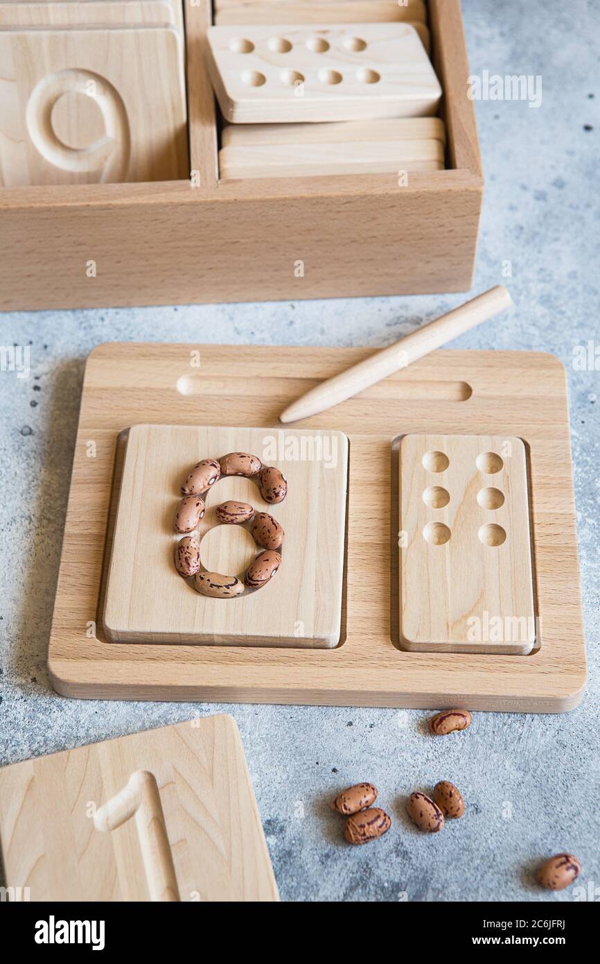 Wooden counting and writing trays - learning resource for educating littles on number writing, fine motor skills, hand eye coordination, mathematical Stock Photo