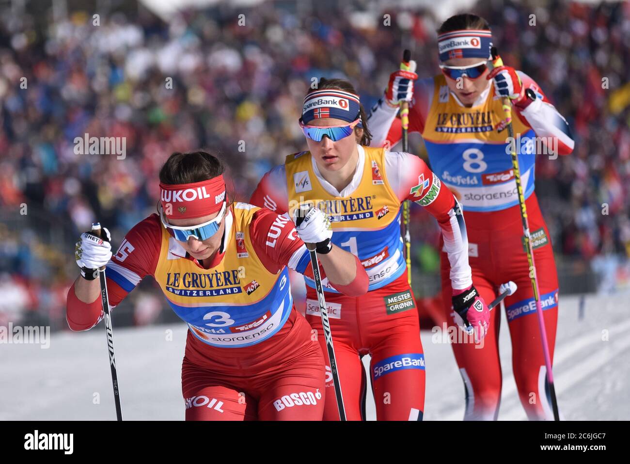 Russia's Natalia Nepryaeva, left, and Norway's Ingvild Flugstad Oestberg, center, skiathlon, 2019 FIS World Nordic Championships, Seefeld, Austria. Stock Photo