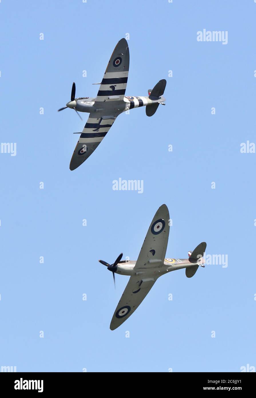 Ditchling, UK. 10th July, 2020. A Spitfire and a Hurricane perform a flypast over the village of Ditchling to honour Dame Vera Lynn whoÕs funeral takes place today, The ÔForces SweetheartÕ died aged 103 in June. Credit: James Boardman/Alamy Live News Stock Photo